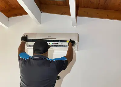Clean Breeze cleaning an air conditioner