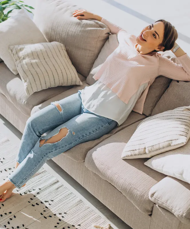 A woman relaxing in a fresh, air-conditioned home